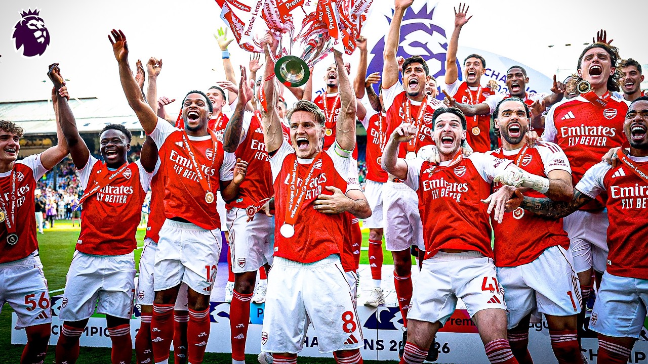The champions lift the Premier League trophy