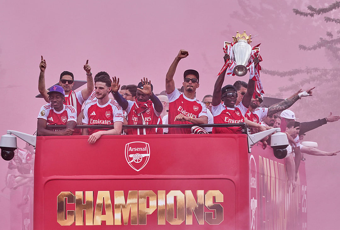 Saka lifting the trophy at parade
